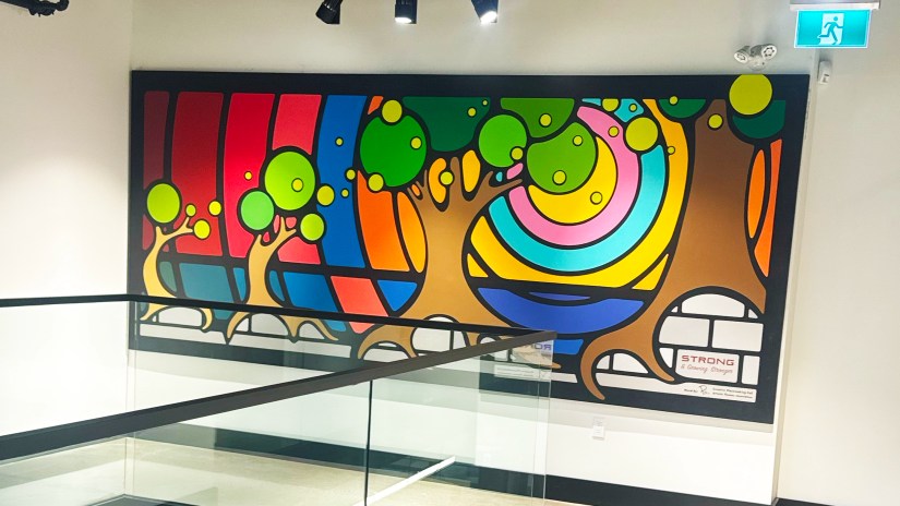 Kingston Mural Artist Po hand painted mural in corporate office building