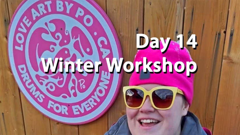 Portia Po Chapman in a pink beanie and sunglasses smiling in front of the Love Art By Po studio sign for Drum December Day 14 Winter Workshop reveal.