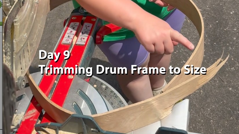 Kingston Artist Po pointing to the trim line. The white oak steam-bent drum frame sits on the chop saw awaiting the first trim.