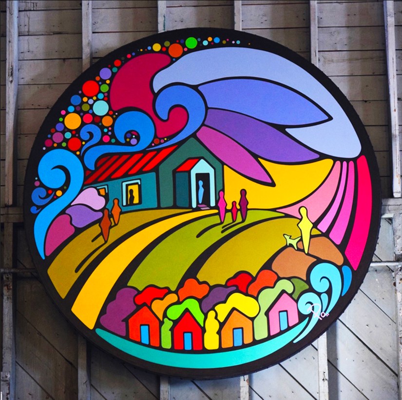 Circular mural design by Kingston artist Portia ‘Po’ Chapman for Base31 in Picton, Ontario, depicting the historic hilltop barracks, Lake Ontario waves, drone light show dots, powerful eagle-shaped clouds, and community members walking together to celebrate the site’s WWII flight school heritage and renewed cultural life.
