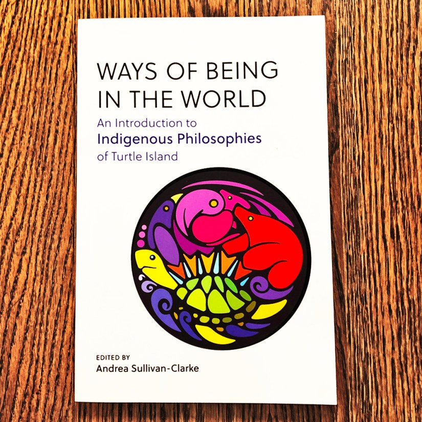 The book cover of Ways of Being in the World: An Introduction to Indigenous Philosophies of Turtle Island, featuring a vibrant circular Storytelling Art illustration by Kingston Artist Portia “Po” Chapman.