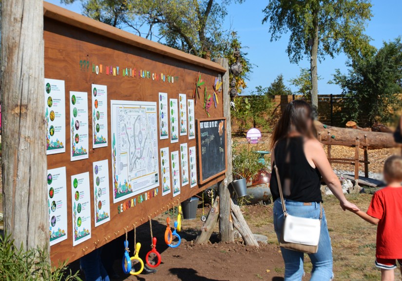 Base 31 Sensory Garden information post billboard featuring border art illustration motifs by Kingston artist Portia "Po" Chapman at the Grand Opening